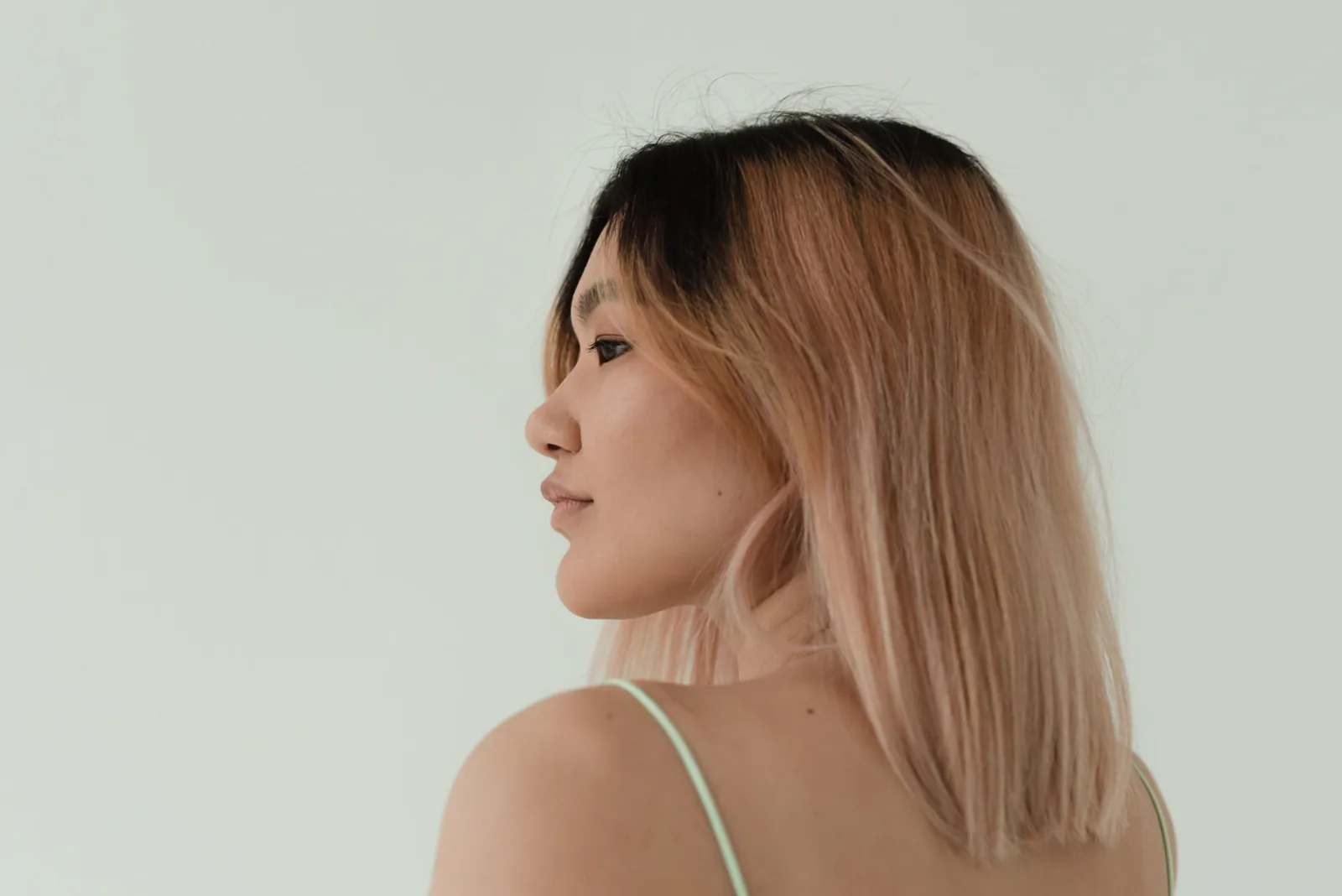 Beautiful balayage hair color result with soft pink tones