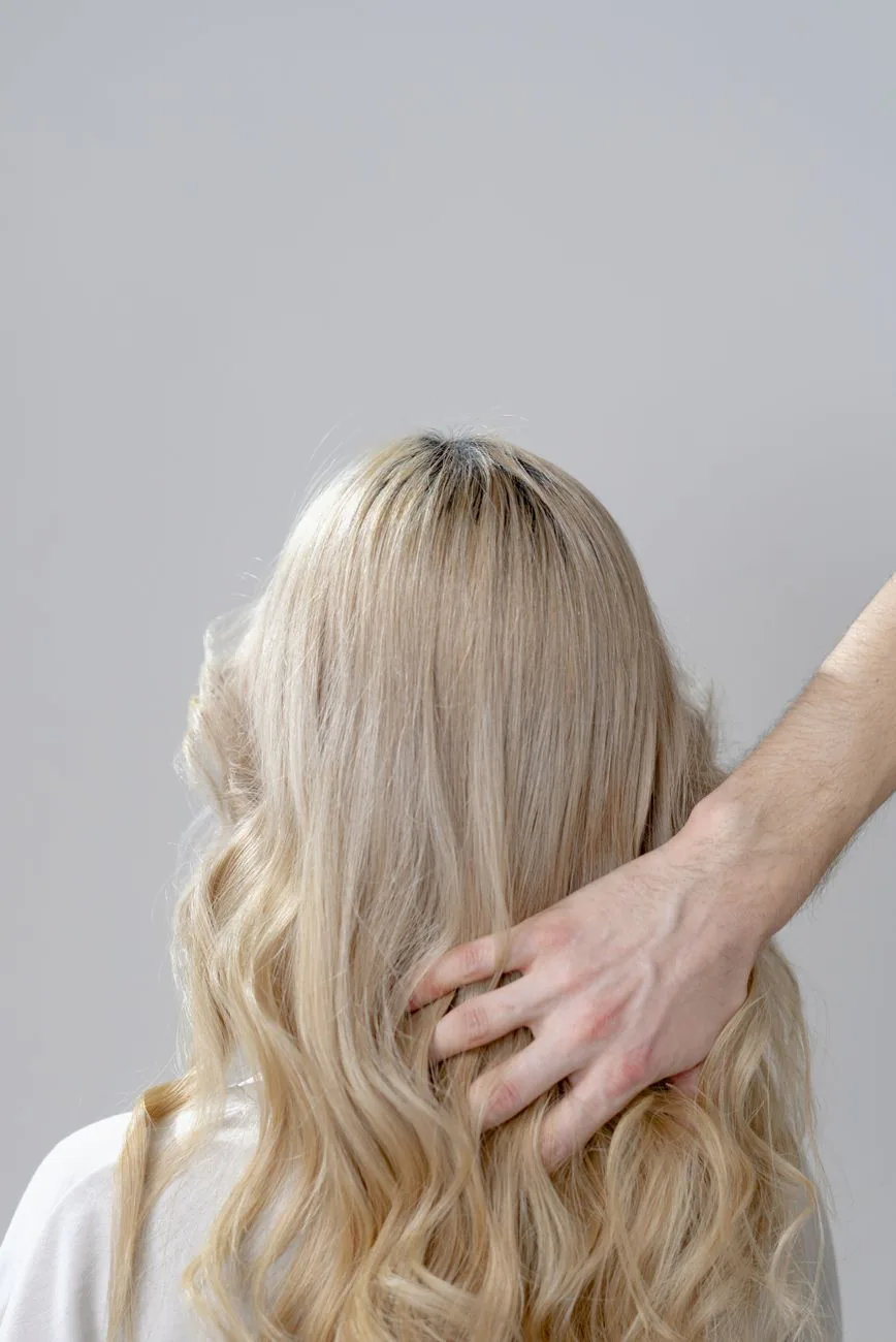 Client with beautifully styled blonde curls